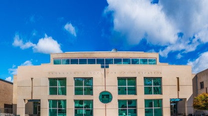 Annenberg School for Communication outside shows the tan building with teal windows