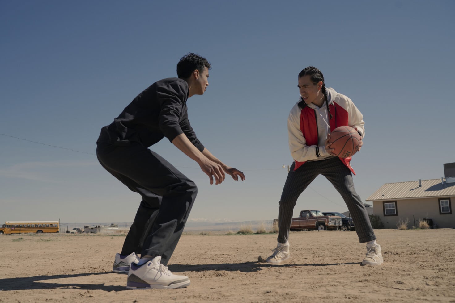 Nataanii and Jimmy play basketball in a still from “Rez Ball.”