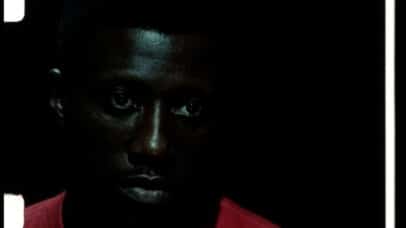 Close up still of Wesley Snipes (wearing a bright crimson shirt) in Rising Sun (1993)