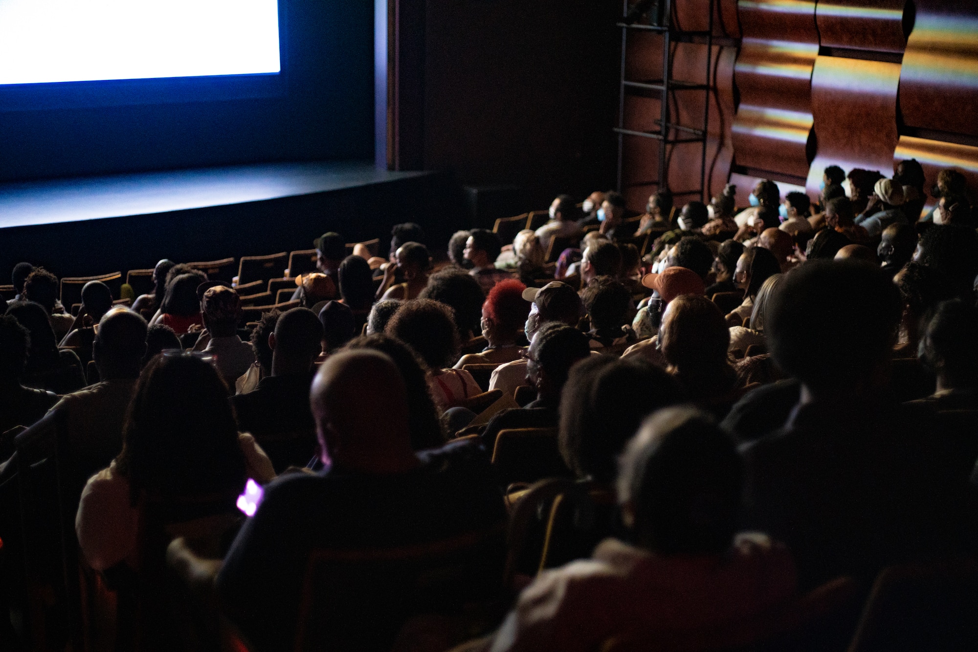 An image of a theater full of people.