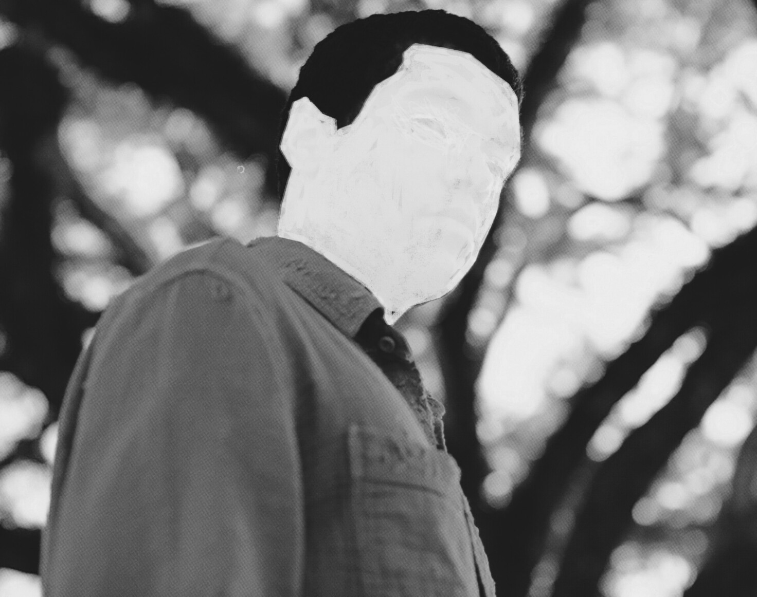 A still from the film Nickel Boys (2024) Aman with his face whited out.