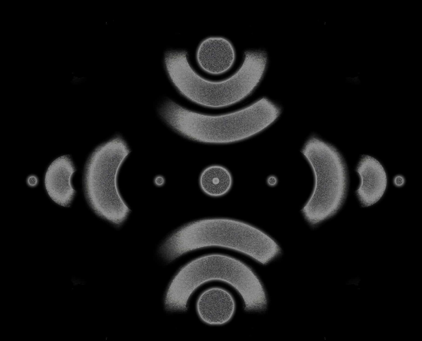 Abstract grey patterns with half-circles and dots create a diamond.