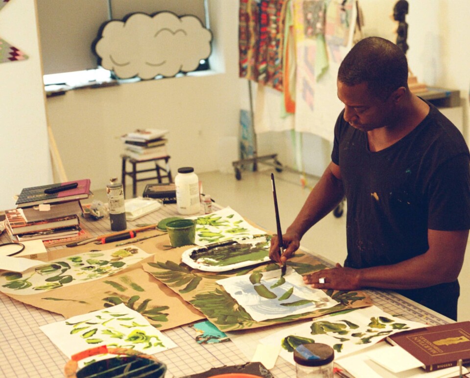 Biggers experiments with green paints on a table.