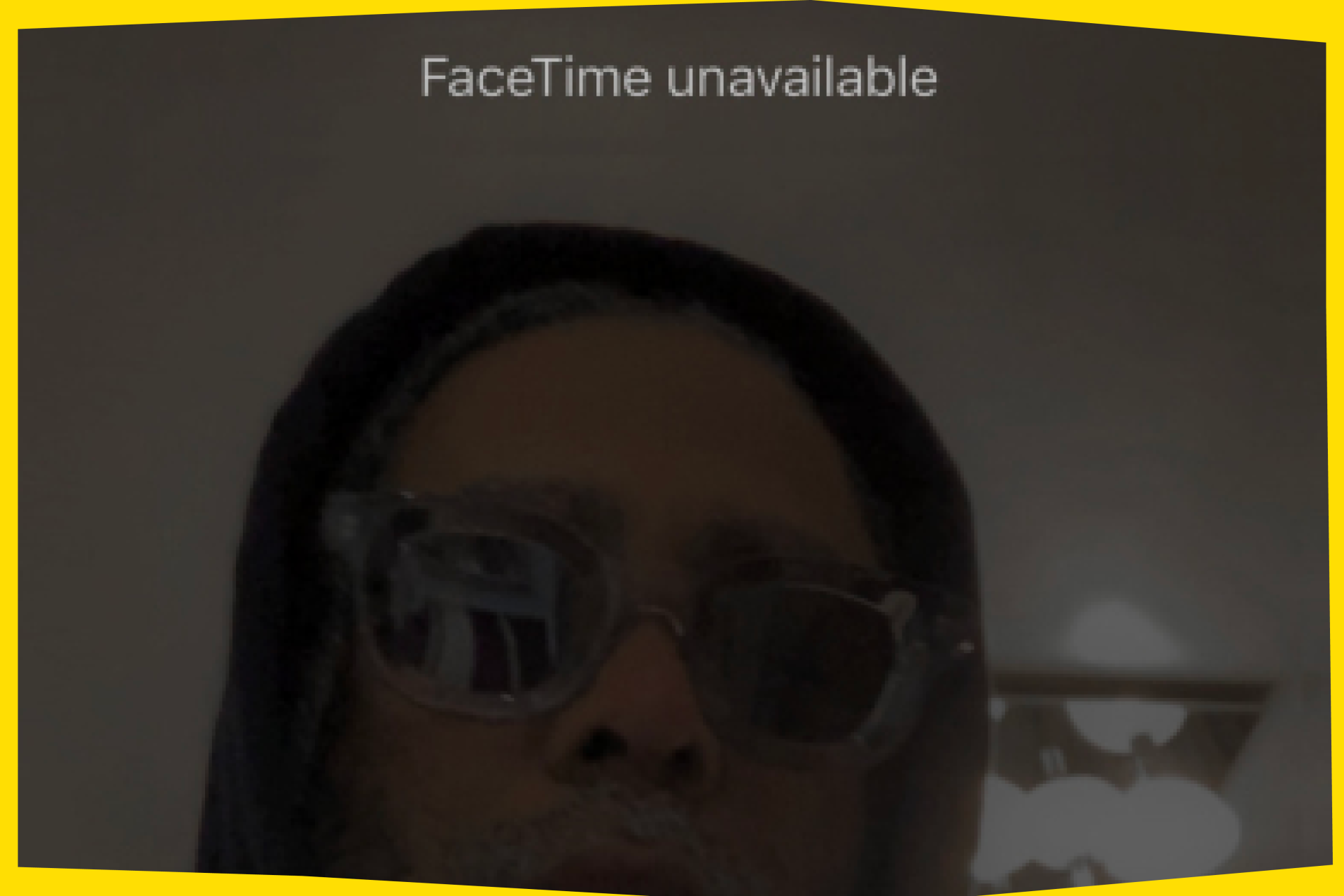 Arthur Jafa looks on in sunglasses and a black hoodie in a photo that looks like a screenshot from an iPhone. At the top it says "Facetime unavailable"