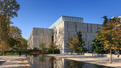 The Barnes Foundation exterior, which shows a looking pool in front of the square building.